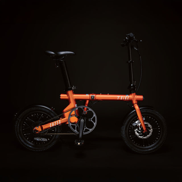 Image of the orange Compact Rider 250 viewed from the side