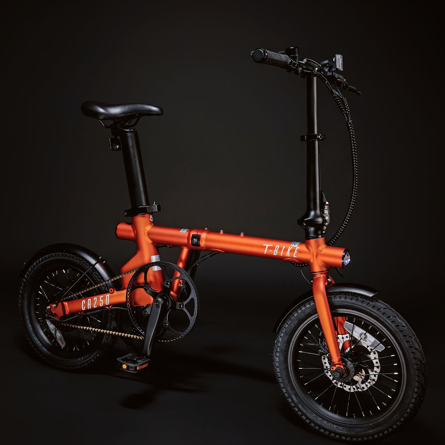 Image of the orange compact rider 250 from an off axis angle