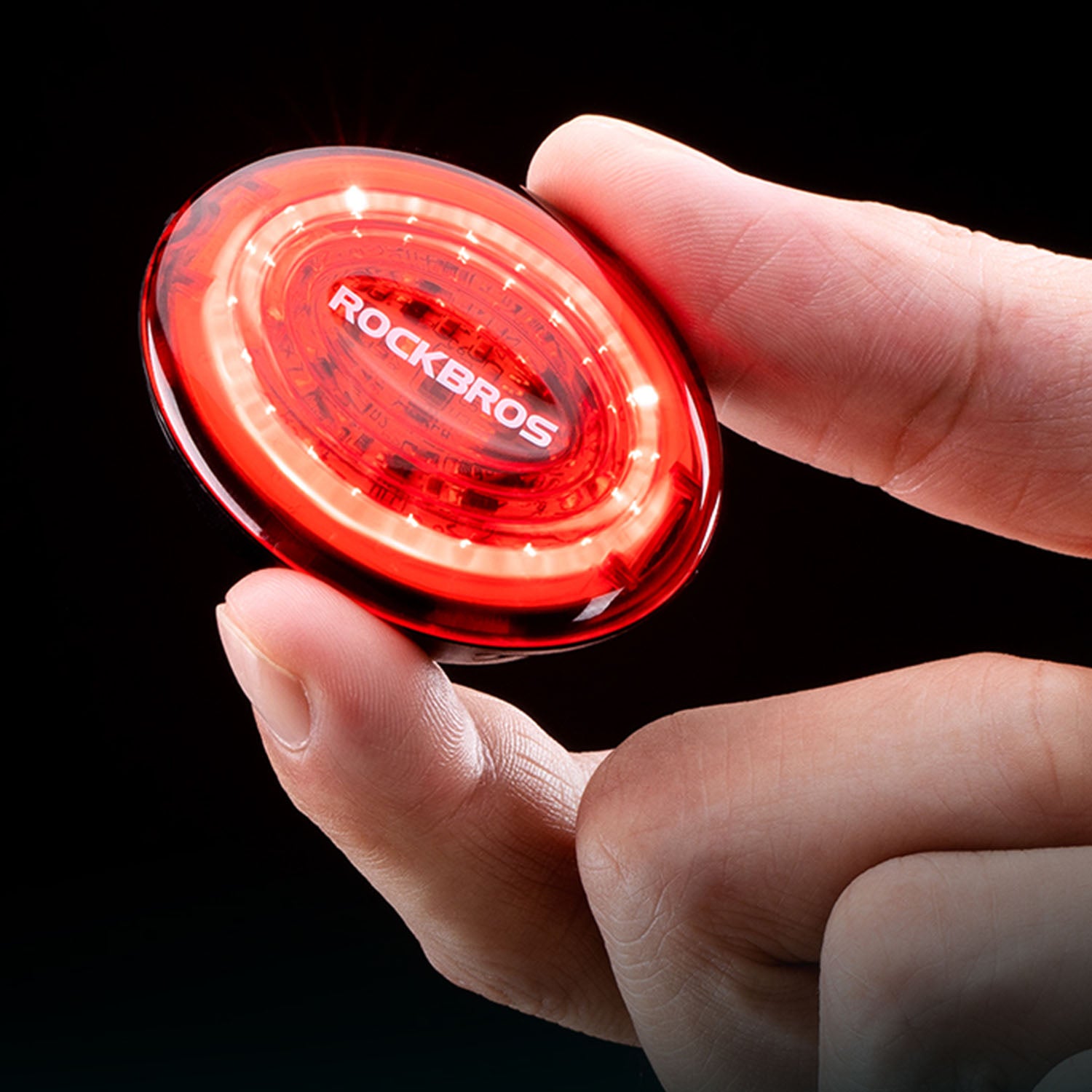 Tail light held in someones hand