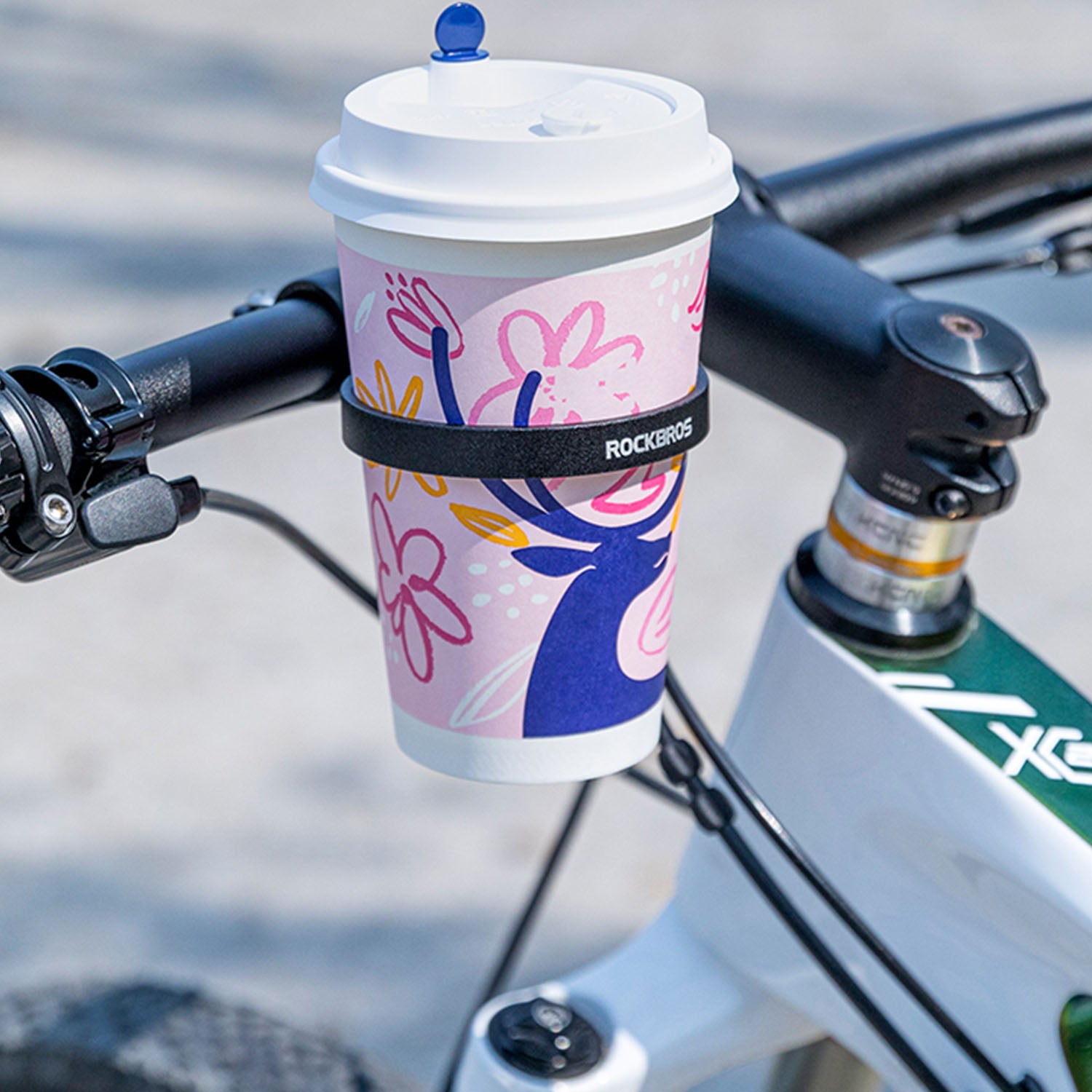 Image of aluminium cup holder with a cup inside of it