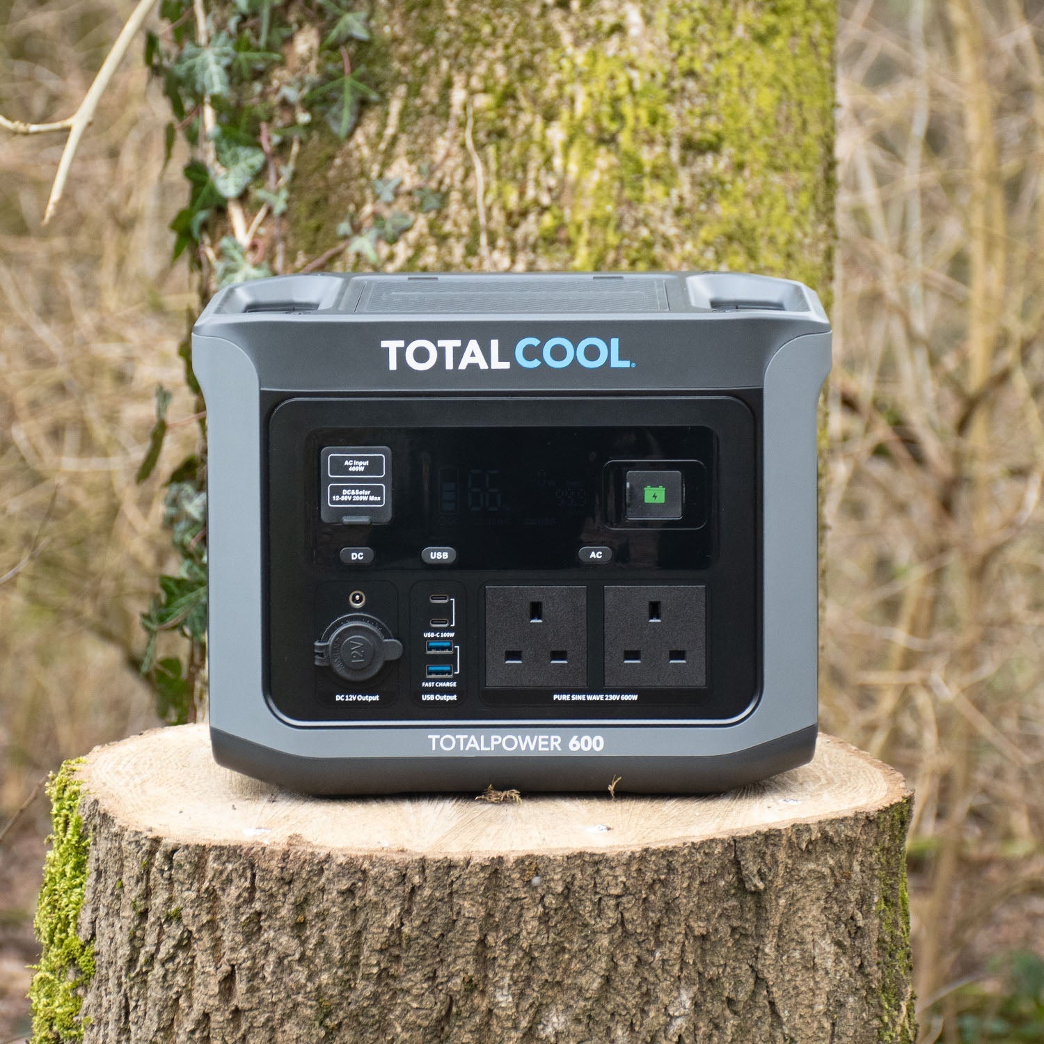 Image of Totalpower 600 viewed from the front ontop of a tree trunk